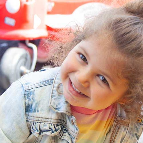 Young girl enjoying the outdoor area at a childcare setting