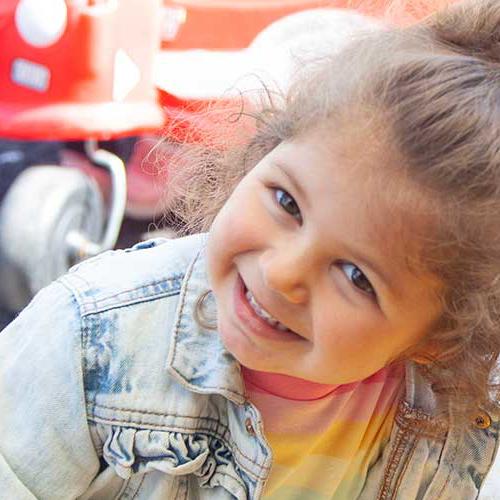 Young girl enjoying the outdoor area at a childcare setting